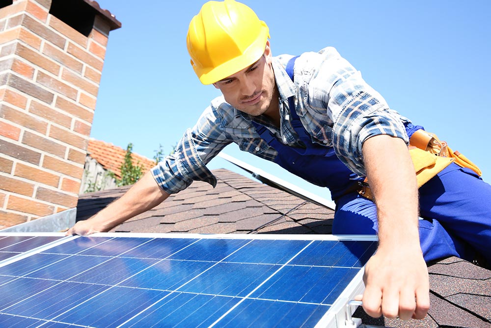 Solar Panels being fitted by contractor to house roof.