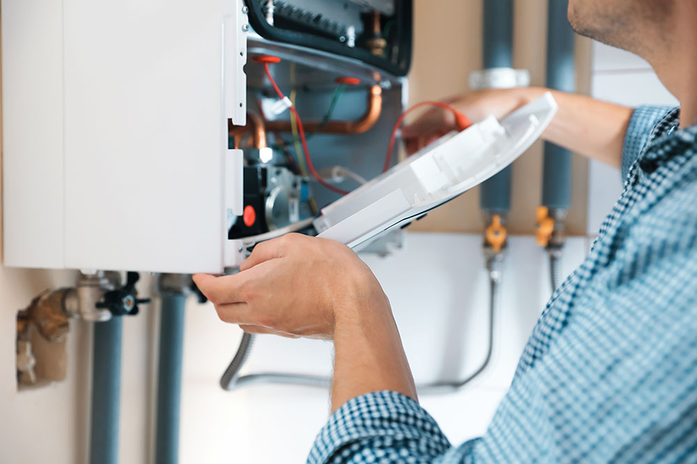 Boiler installation Engineer installing new boiler